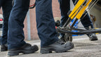 First responder in HAIX Airpower XR2 EMS boots next to stretcher