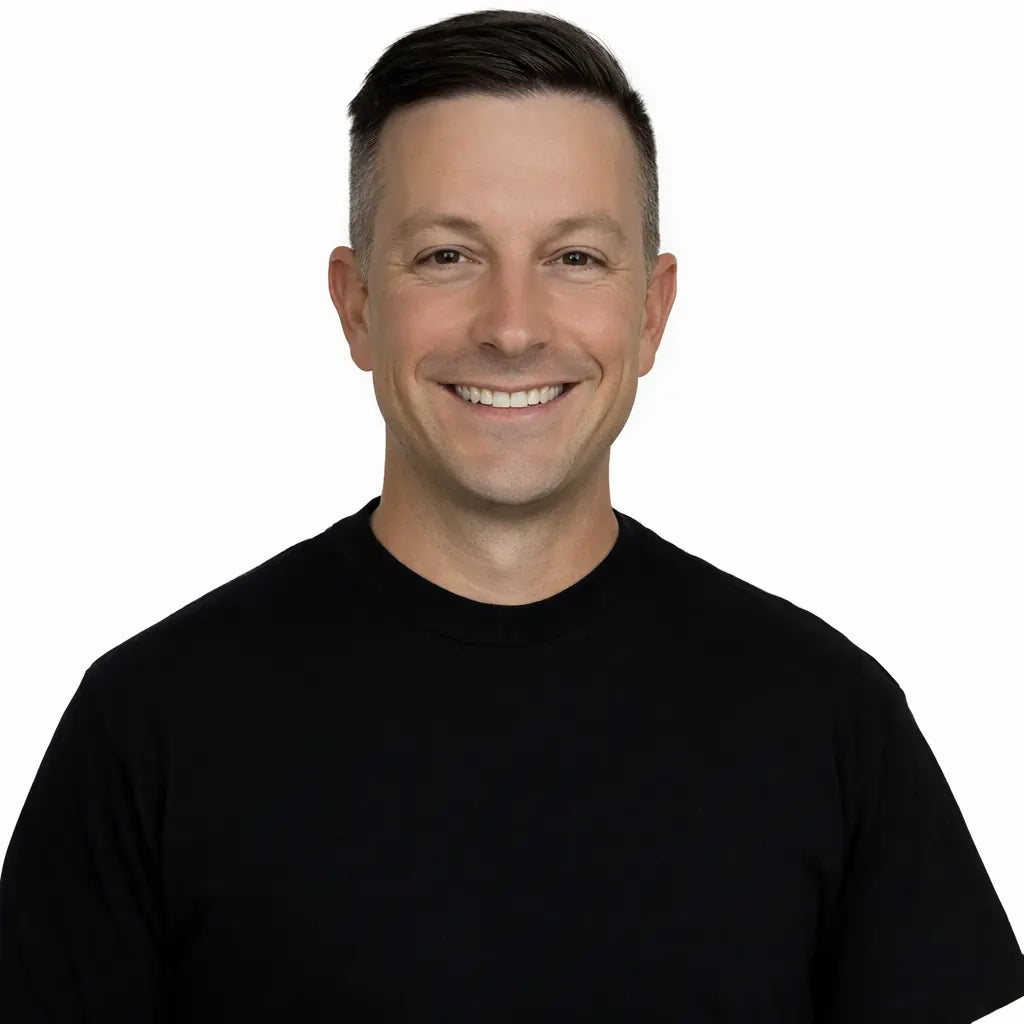 Kurt Wissing headshot - Man wearing a black shirt on a white background